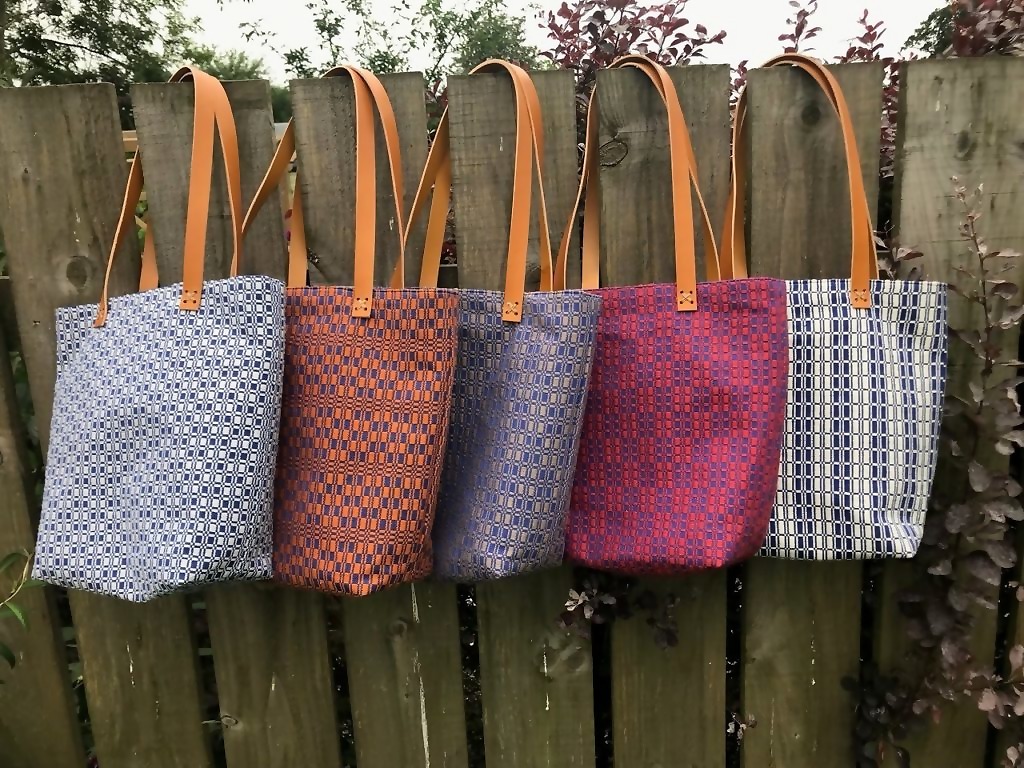 Handwoven tote bags with leather handles
