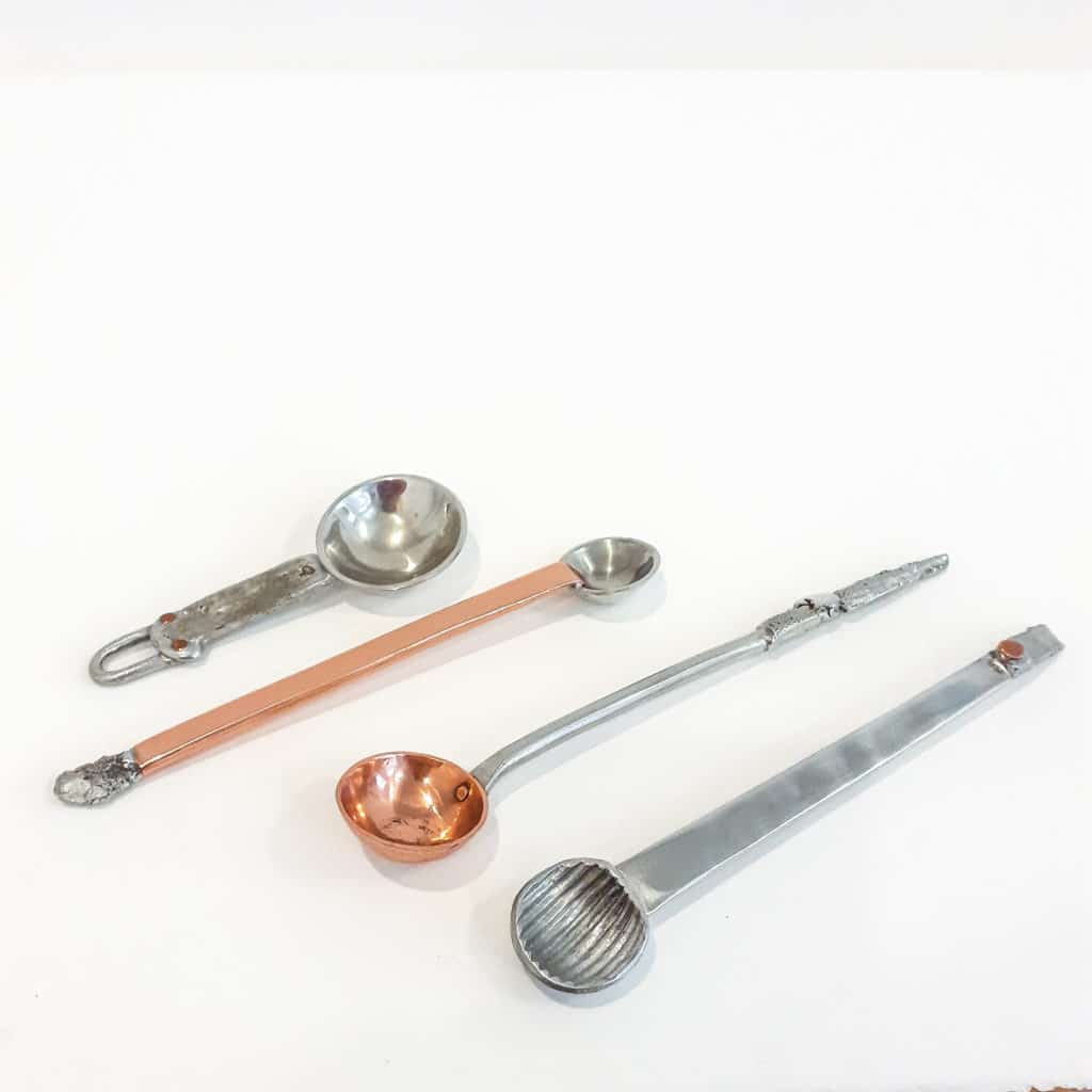 Pewter and copper spoons