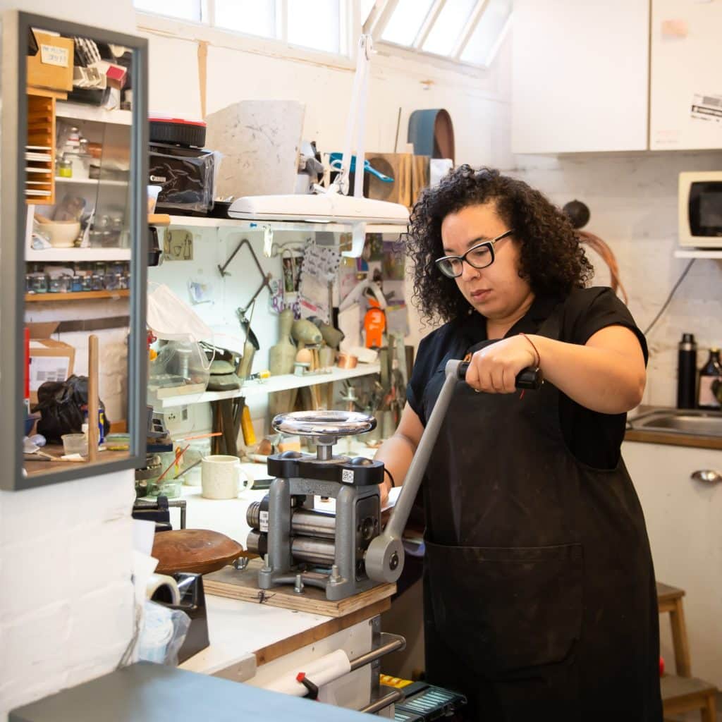 Ella in her pewtersmithing workshop