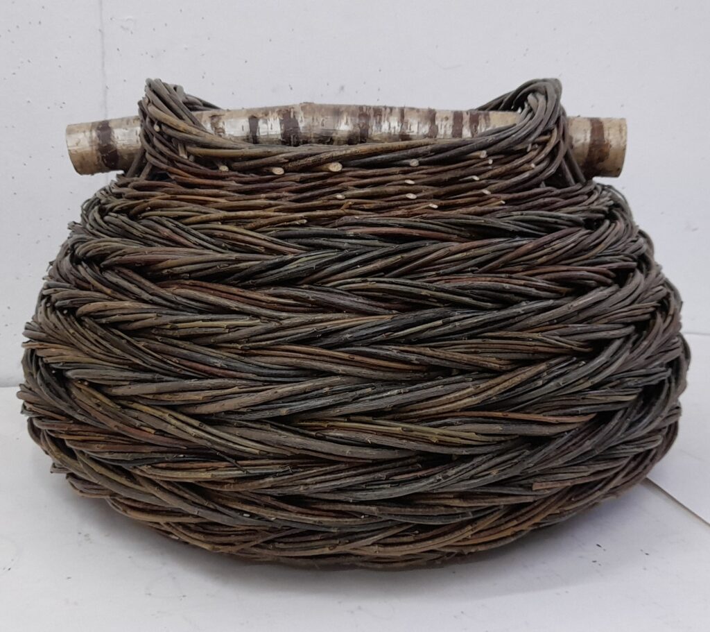 Curvaceous herringbone weave basket with stripy hazel handle