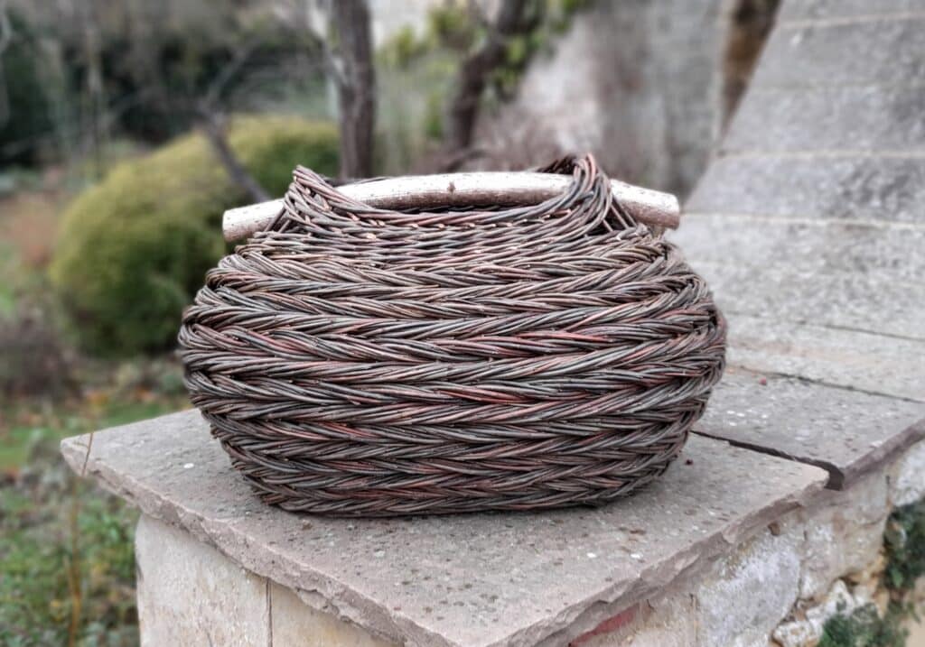 Bulbous oval herringbone weave basket with hazel handle