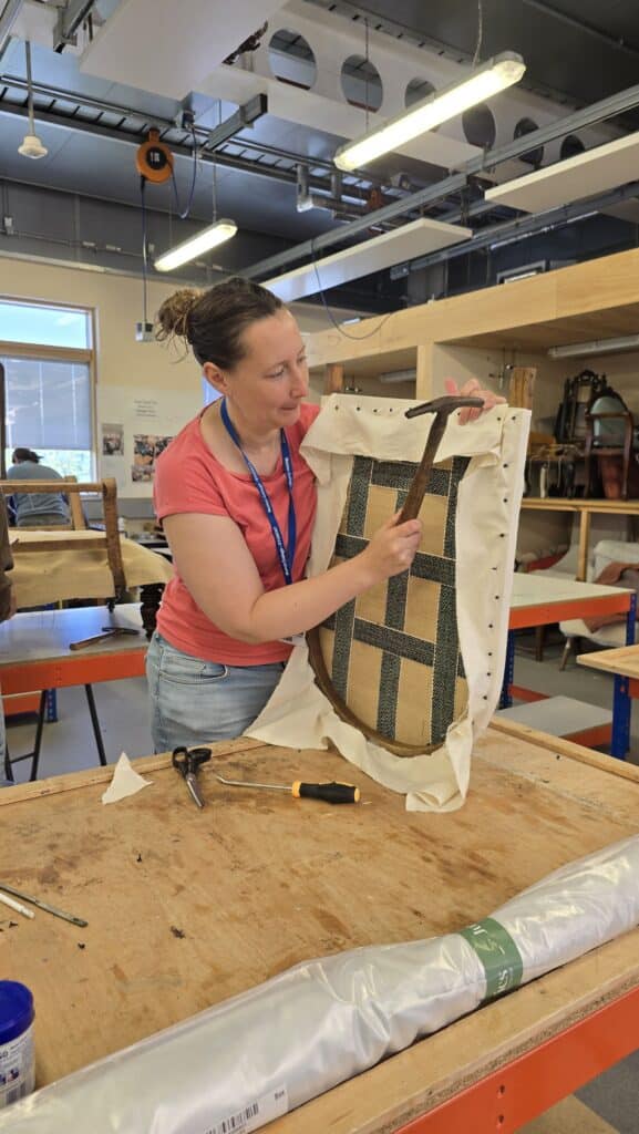 Nancy Johnston, upholstering