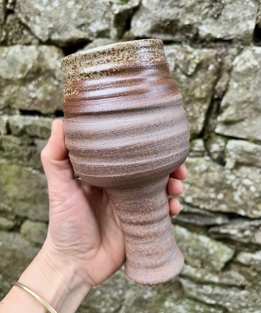 Dark wine glass with thistle ash