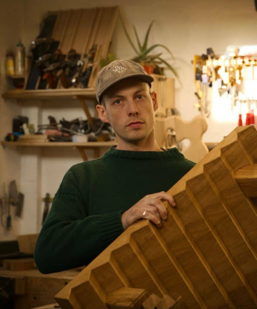 James in the workshop with sawtooth coffee table