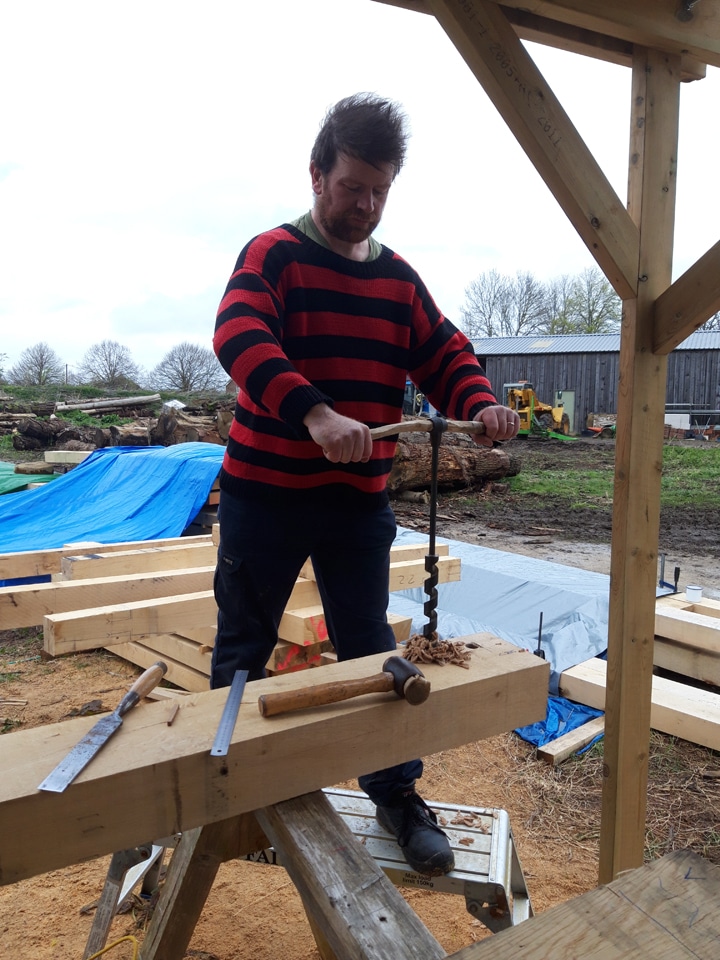 Hugh augering mortices for green oak frame