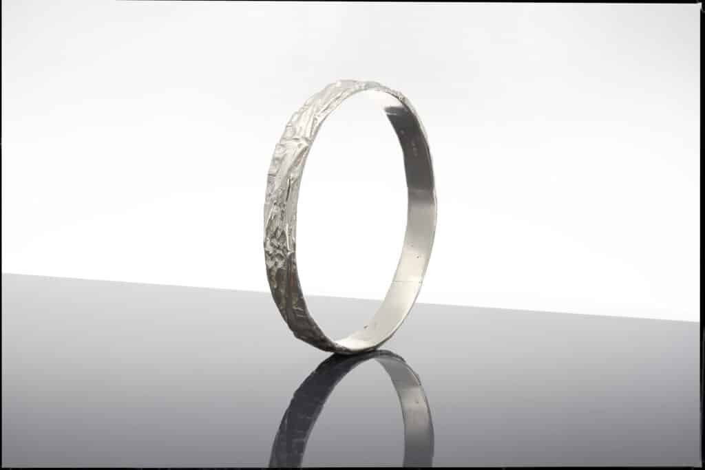 Carved silver bangle