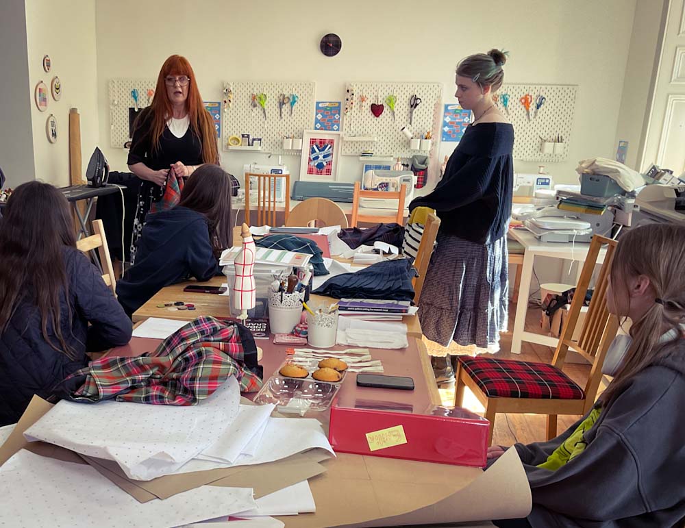 Headteacher and Master Kiltmaker Siobhan teaching our Saturday Club of young people