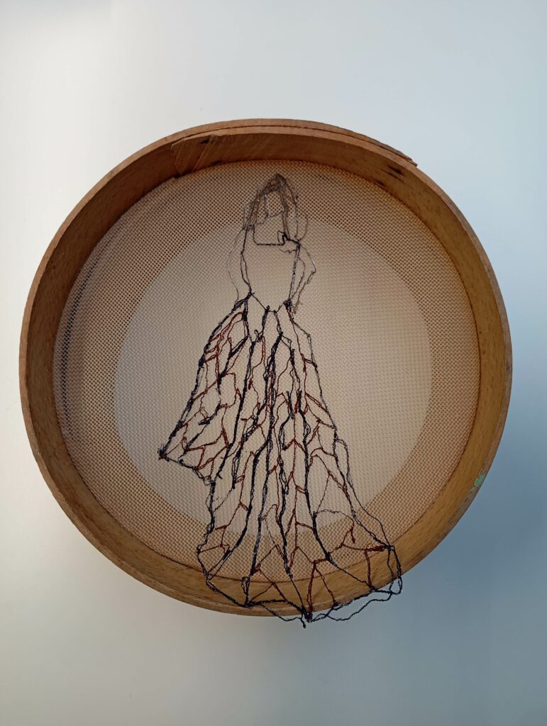 Remembering, embroidery on a vintage sieve