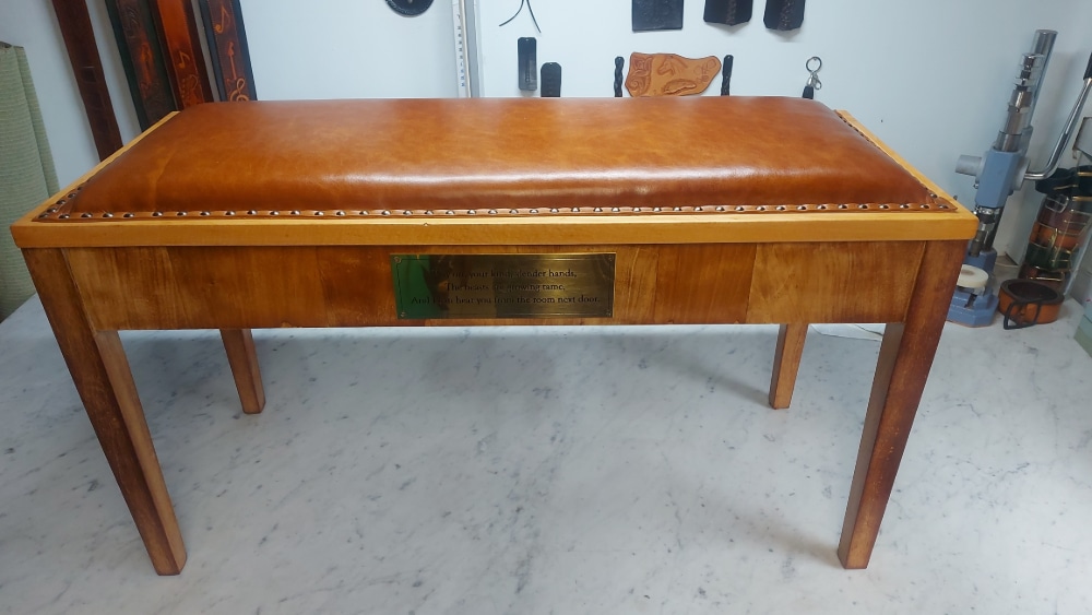 A recovered piano seat