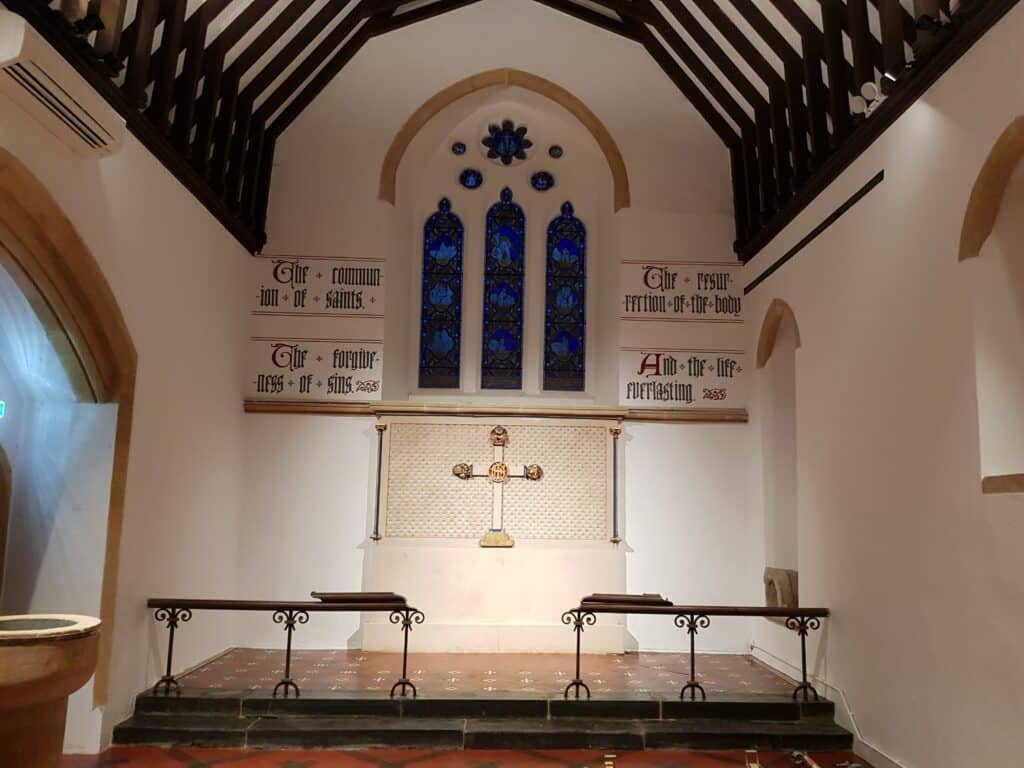 Reinsatement of lettering inside a church