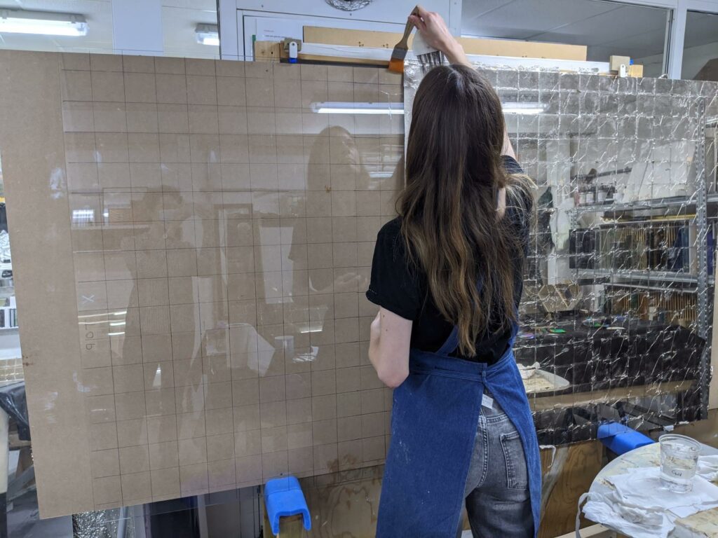 Gilding 19ct leaf onto glass for a bespoke artwork