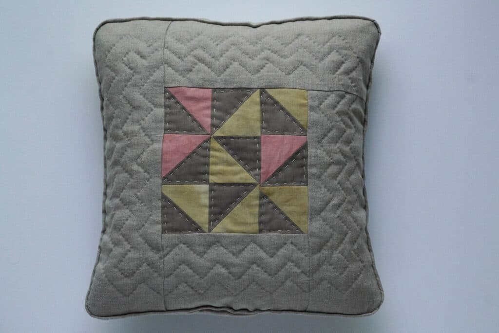 Hand quilted, naturally dyed patchwork cushion
