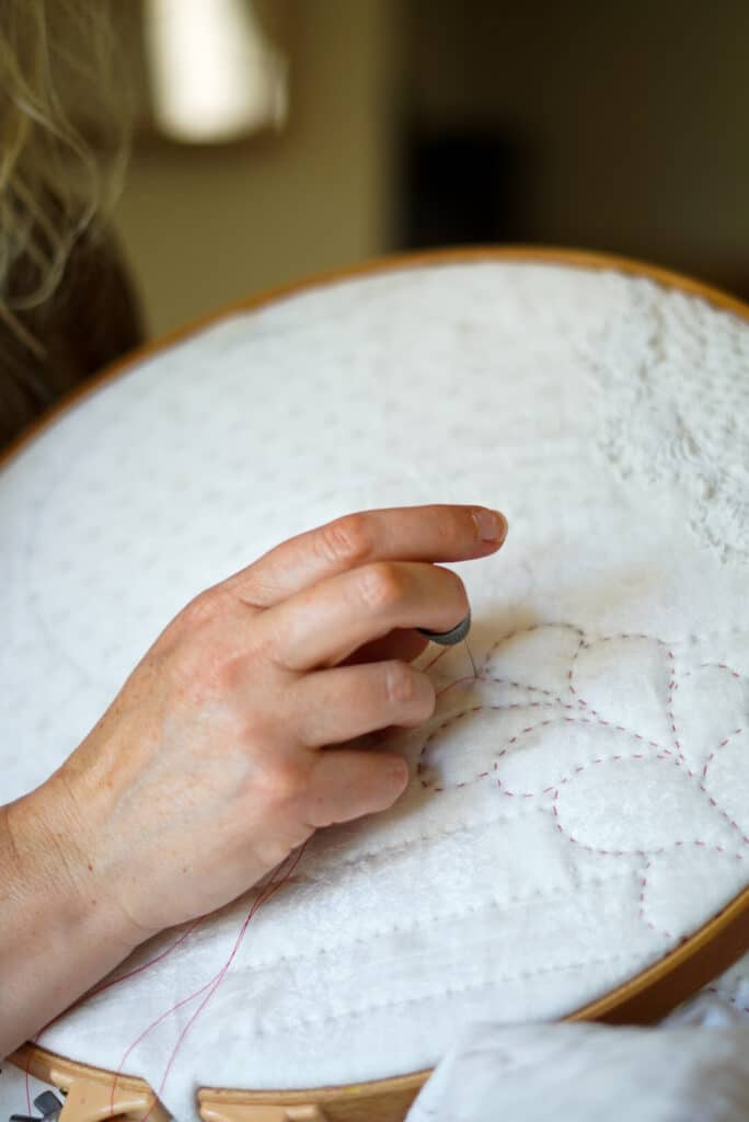 Hand quilting with a rocking stitch