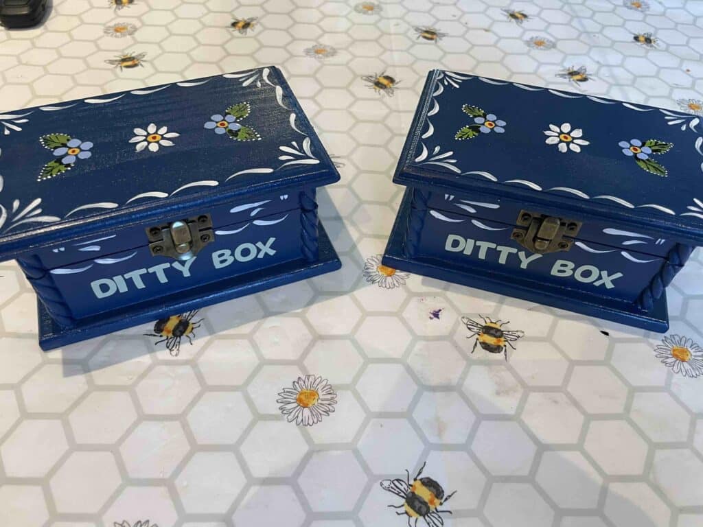 ‘Ditty Box’  A ‘Ditty Box’ is a 19th Century phrase coined to describe a small box fashioned by Boatmen, Sailors and Fishermen in which to store precious personal items as well as things like needle and thread and soap.   Our ‘Ditty Boxes’ are traditionally hand painted with a contemporary twist that features vinyl lettering on the front.
