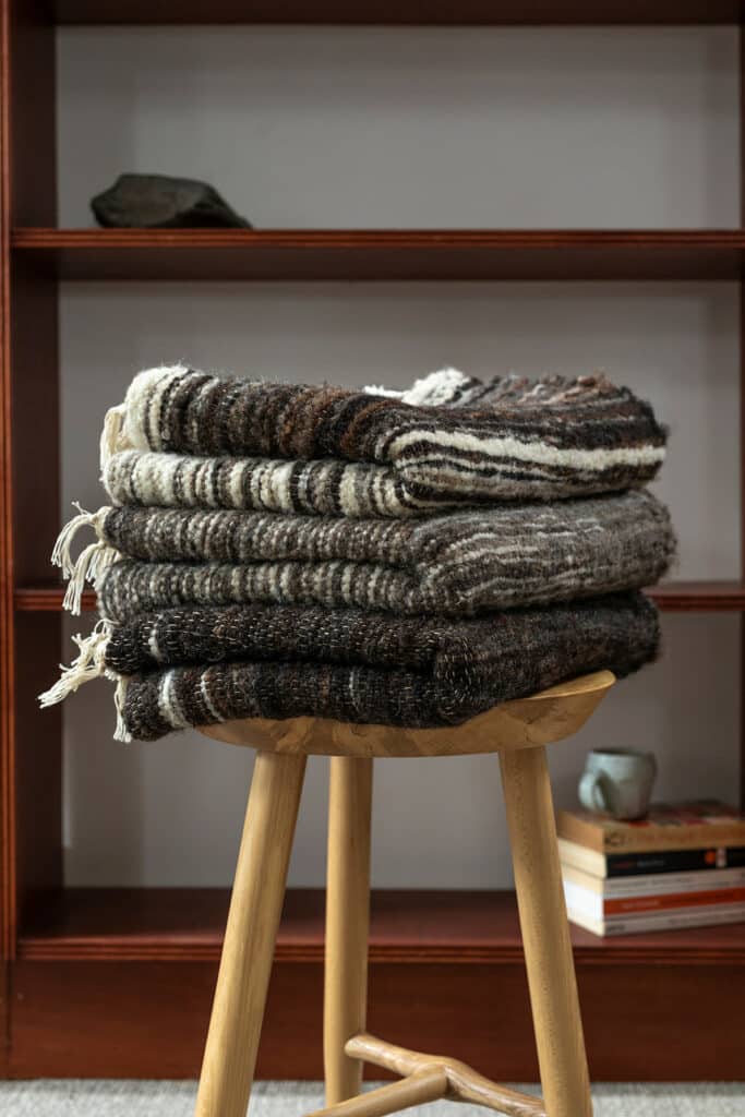 Handwoven rugs in raw unspun wool