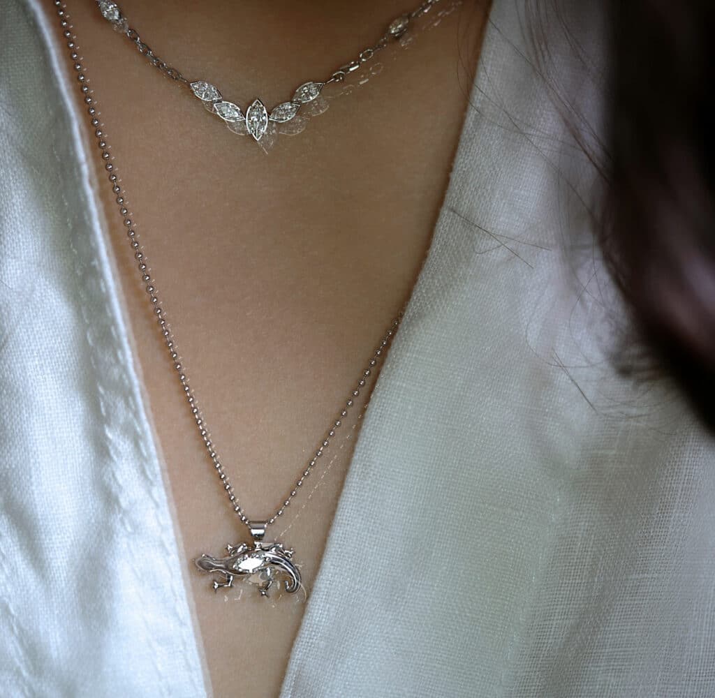 Diamond necklaces in 18K white gold by Lena Cohen Jewellery London. Marquise-cut diamond cluster and Salamander pendant.