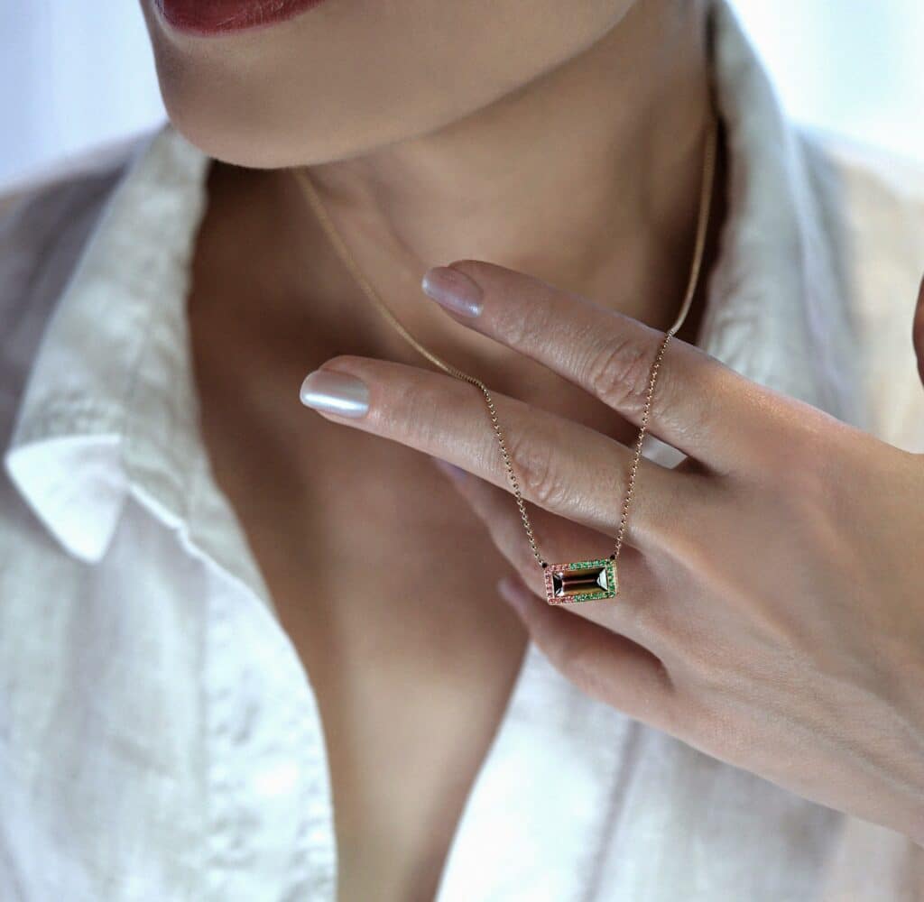 Watermelon tourmaline pendant necklace in 18K solid gold. Lena Cohen Jewellery London fine handcrafted gemstone necklace, quiet luxury natural tourmaline jewellery.