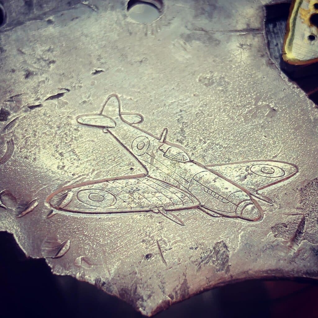 Spitfire engraved on the shrapnel of the plane