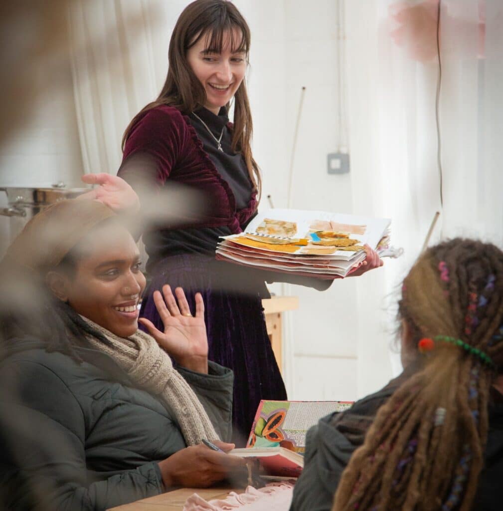 Workshop participant wearing a Suspended in Sunbeam Headscarf