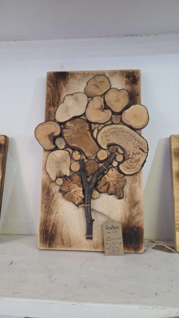 Native species wood slice tree mosaic with plywood back board.