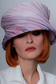 Sinamay hat covered with ombre strips and rouleaux of fine cotton organdie.