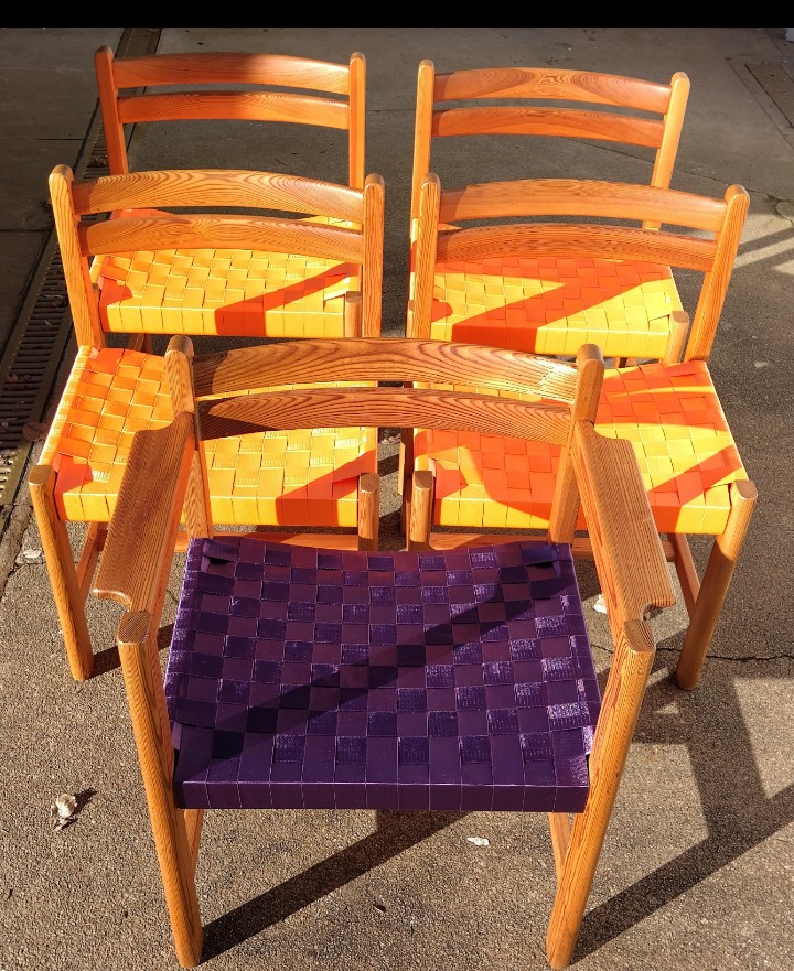 We woven new seats for these five chairs using shaker tape techniques but using “seatbelt” material in orange and purple.