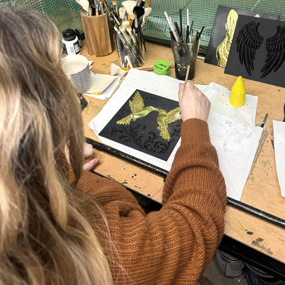 Hand finishing gold leaf framed wall art