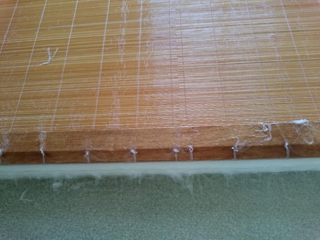 Building a stack of papers using the sugetta (Japanese frame &bamboo mat(