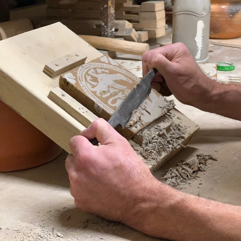 Paring back the inlay on a leather hard tile